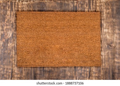 Natural Coir Doormat On Antique Wooden Texture, Background