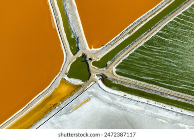 natural colors, geometric shapes, abstract shapes, red, pink, blue, yellow, etc. in the salt lake. salt, mineral, soda factory. A lake with both touristic and economic value. abstract and background - Powered by Shutterstock