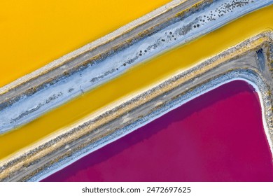 natural colors, geometric shapes, abstract shapes, red, pink, blue, yellow, etc. in the salt lake. salt, mineral, soda factory. A lake with both touristic and economic value. abstract and background - Powered by Shutterstock