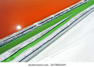 natural colors, geometric shapes, abstract shapes, red, pink, blue, yellow, etc. in the salt lake. salt, mineral, soda factory. A lake with both touristic and economic value. abstract and background - Powered by Shutterstock