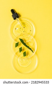 Natural Cosmetic Laboratory Concept. Petri Dishes With Cosmetic Gel, Scrub And Pieces Of Aloe Vera Plant On Bright Yellow Background Top View, Vertical Image. 