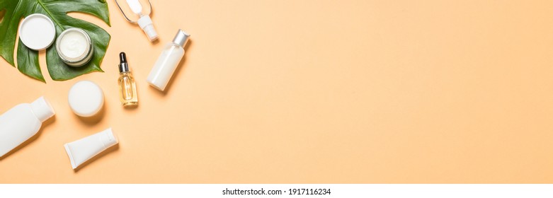 Natural cosmetic products at color background. Cream, mask, lotion for face and body care. Top view image with copy space. - Shutterstock ID 1917116234