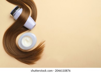 Natural Cosmetic Products And Hair Lock On Beige Background, Flat Lay. Space For Text