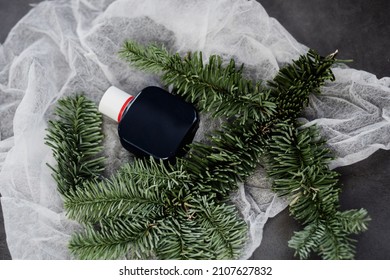 Natural Cosmetics. A Bottle Of Perfume On A Fir Branch. Men's Cologne