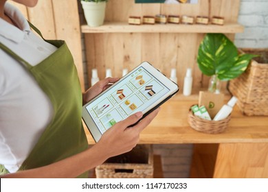 Natural Cosmetics Shop Owner Checking Website Of Her Online Store