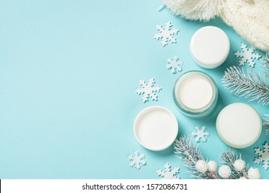 Natural Cosmetics For Winter. Winter Cream For Skin, Skincare Product. Top View On Blue Background.