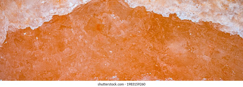 Natural Crystal Pakistani Orange Salt Background, Top View. Himalayan Coral Pink Rock Salt Backdrop, Banner. Himalayan Block Salt Texture