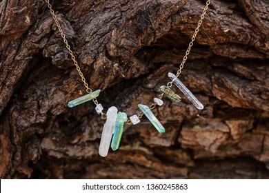 Natural Crystal Quartz Stone Necklace On Natural Wooden Background