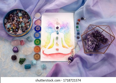 Natural Crystals And Pendulum On Pastel Silk Background. Reiki Background With Card.