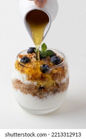 Natural Curd With Blueberry, Granola And Honey. Healthy Food Concept