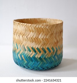 Natural cylinder bamboo basket craft coloring with splash of blue turquoise color. Woven bamboo handy craft isolated on white background. - Powered by Shutterstock