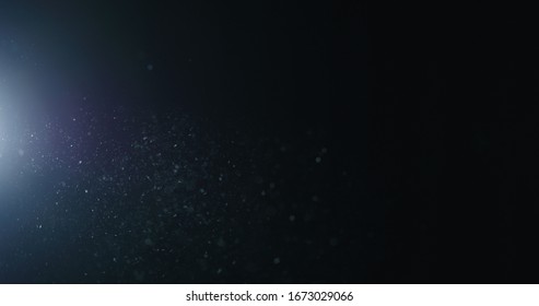 natural dust particles flow in air on black background - Shutterstock ID 1673029066