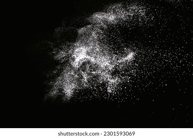 Natural dust particles flow in air on black background