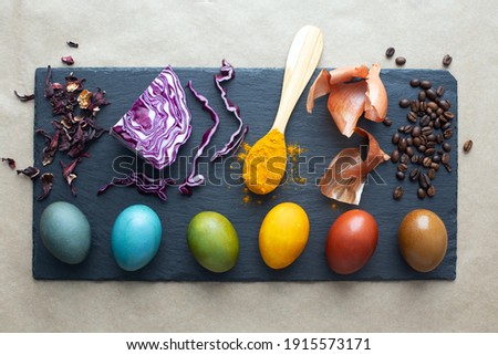 Natural dye for easter eggs - carcade, red cabbage, turmeric, onion skin and coffee. Homemade colored easter eggs with ingredients