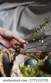 Natural Easter decorations, gently placing the first blooms of spring for a natural Easter display                                