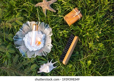 Natural, Eco-friendly Cleaning Tools: Soda In Glass Flower Bowl Near Bamboo Brush, Clean Homemade Solution And A Vial Of Essential Oil, Soap On Green Grass, Outdoor Background