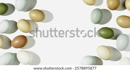 Natural eggs repeat pattern, green brown blue colored Chicken egg with shadow at sunlight, creative food banner. Minimal Easter holiday concept, top view still life photo, trend patterns, flat lay