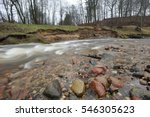 Natural erosion, shore of wild forest river