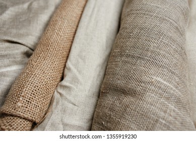 Natural Fabrics From Organic Colors Of Flax And Cotton In Rolls, Homespun Textile Handmade. Burlap And Canvas For Eco, Rustic, Boho, Hygge Decor