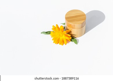 Natural Face Cream With Calendula Extract. Bamboo Jar. Calendula. White Background