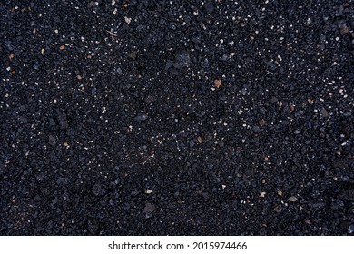Natural fiery ash with a black texture of black coals. Wood soot background and texture. Place for your text. Concerogen, ecology.