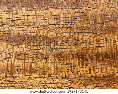Natural flame koa patterned Solid wood That has beautiful and clear wood grain Used to decorate with copy space. Background,wallpaper or texture.
