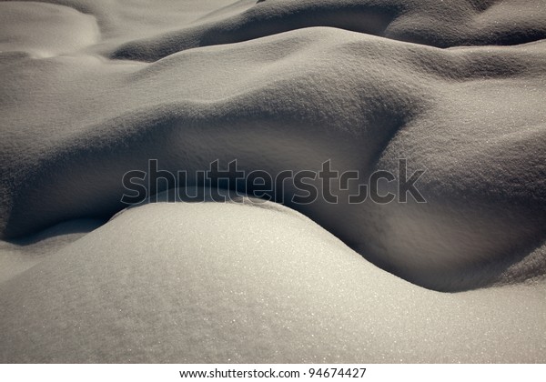monochrome natural forms in the snow of abstract woman's body.