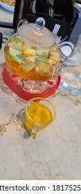 Natural Fruit & Flower Tea In A Tea Pot. This Flower Tea Is Infused With Apple, Orange And  Passion Fruit That Gives Off A Fruity Tropical Flavor With A Hint Of Citrusy After Taste