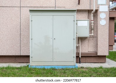 Natural Gas Distribution Infrastructure. Closed Metal Boxes Near The Apartment Building.