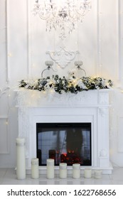 Natural Gas Fireplace Decorated With Christmas Ornaments, Candles And Basket Of Dried Pine Cones For The Holiday Season