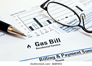 Natural Gas Heating Bill With Pen And Glasses