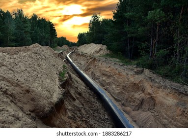 Natural Gas Pipeline Construction. Building of transit petrochemical pipe in forest area. Pipes Welding