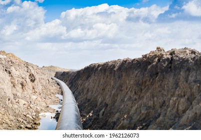 Natural Gas Pipeline Construction Work. A Dug Trench In The Ground For The Installation And Installation Of Industrial Gas And Oil Pipes. Underground Work Project