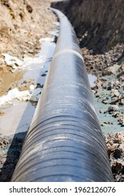 Natural Gas Pipeline Construction Work. A Dug Trench In The Ground For The Installation And Installation Of Industrial Gas And Oil Pipes. Underground Work Project