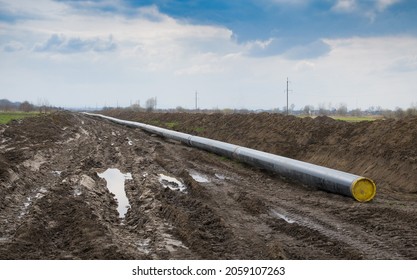 Natural Gas Pipeline Construction Work. A Dug Trench In The Ground For The Installation And Installation Of Industrial Gas And Oil Pipes. Underground Work Project