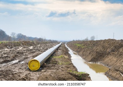 Natural Gas Pipeline Construction Work. A Dug Trench In The Ground For The Installation And Installation Of Industrial Gas And Oil Pipes. Underground Work Project