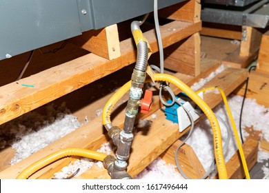 Natural Gas safety shut off valave in attic of a home - Shutterstock ID 1617496444
