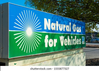 Natural gas for vehicles sign advertises cleanest burning alternative fuel at compressed natural gas CNG fueling station by PG&E, Pacific Gas and Electric Company - San Carlos,  CA, USA - 2019