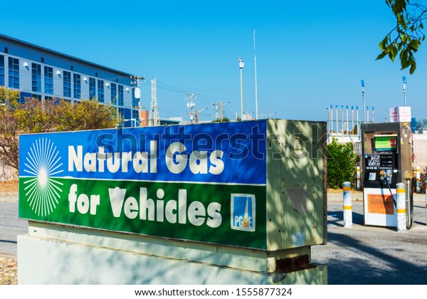 Natural gas for vehicles sign advertises cleanest\
burning alternative fuel at compressed natural gas CNG fueling\
station by PG&E, Pacific Gas and Electric Company - San\
Carlos,  CA, USA - 2019