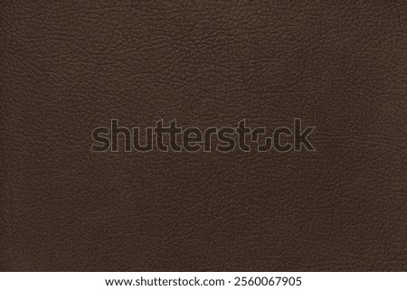 Natural, genuine solid brown leather texture close up, macro. Structure of matte leatherette, artifical skin surface with embossing pattern. Background, wallpaper, backdrop