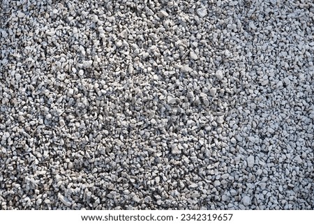 Natural Gray limestone Chippings, Macadam, Rubble or Crushed Stones Background Top View. Macro