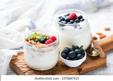 Natural Greek Yogurt With Fresh Berries And Granola In Jar. Healthy Eating, Healthy Lifestyle, Sporty Fitness Food Menu Concept - Powered by Shutterstock