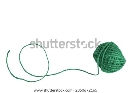 Natural green jute twine skein isolated on white background with clipping path. String, yarn ball, Hemp rope ball