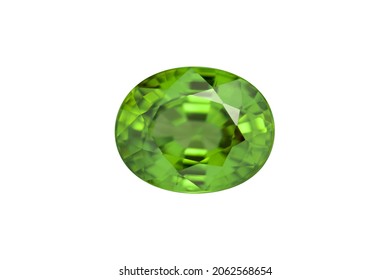 Natural green peridot chrysolite olivine gemstone setting. Oval in Thailand faceted, clean unheated gem for jewelry making. Closeup macro details facets. Isolated on white background. Gemology theme.