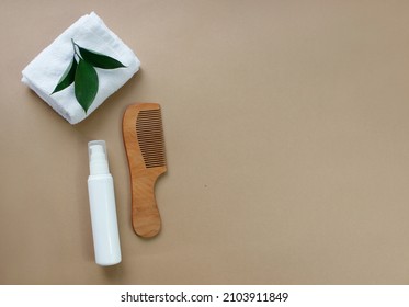 Natural Hair Care Products, Hairbrush, Towel And Leaves. Top View. Shampoo, Mask, Balm. Flatlay