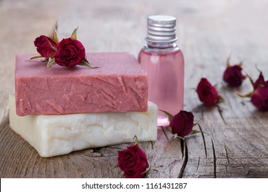 Natural Hand Made Soap With Dry Pink Roses On Vintage Wooden Background Spa Setting