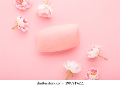 Natural hand soap and beautiful roses on light pink table background. Pastel color. Care about clean and soft body skin. Daily beauty product. Closeup.  - Powered by Shutterstock