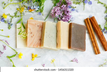 Natural Handmade Soap Bars With Organic Medicinal Plants, Cinnamon Spice And Flowers.Homemade Beauty Products With Natural Essential Oils From Plants And Flowers, Top View Closeup Photo