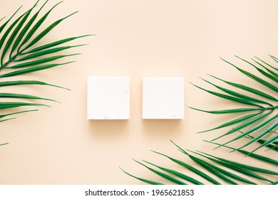 
Natural Handmade Soap And Palm Leaves On A Beige Background, Top View. Skin Care And Beauty Concept. Mockup For Design.