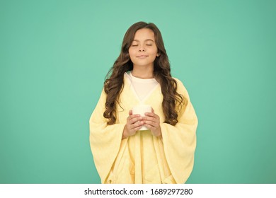 Natural Healthy Beverage. Cosy And Fluffy Pajama. Feeling Comfortable At Home. Happy Girl With Tea Cup. Good Morning Drink. Small Kid Blue Background. Little Girl Drink Cocoa Or Milk Before Sleeping.